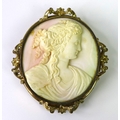 A large Victorian cameo carved as a Classical beauty with flowing hair, the yellow metal mount with ... 