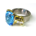 A modern designer ring set with large chequerboard cut blue topaz on palladium shank, the 18ct gold ... 
