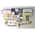 A collection of silver and vintage costume jewellery, including a charm bracelet, 2.3toz, and enamel... 