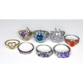 A group of 9ct gold rings, comprising six white gold dress rings set with coloured stones, and two y... 