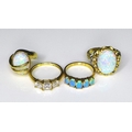 A group of three 15ct gold rings, comprising a ring set with a large oval opal in a scalloped claw s... 