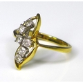 An 18ct gold and diamond ring of seedpod design, composed of six diamonds each of approximately 0.04... 