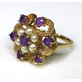 A gold, amethyst and pearl dress ring, comprising seven amethysts and six pearls in a stylised textu... 