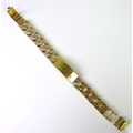 A 9ct gold identity bracelet, bark texturing to curb links, central plaque engraved, plaque and link... 