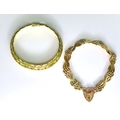 Two 9ct gold bracelets, one fancy link, approximately 6.8cm diameter, the other with a heart padlock... 