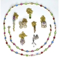 A group of gold necklaces, comprising an 18ct gold necklace set with multicoloured stones, 44.5cm lo... 