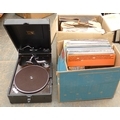 A vintage HMV record player together with a quantity of records and LPs.
