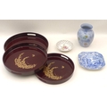 A selection of Japanese lacquered trays together with a vase, the base printed 'Alfama, Made in Engl... 