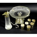An early 20th century Continental silver liqueur decanter with six matching silver cups, all chased ... 