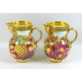 A pair of modern Royal Worcester ‘Pineapple Mask’ jugs, decorated with peaches and pears, limited ed... 