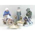 Two modern Royal Copenhagen figurines, comprising fisher woman, 465, and huntsman with shotgun and d... 