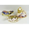 A group of three Royal Crown Derby paperweights, comprising Lion, MMI, gold stopper, 18 by 14cm high... 