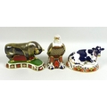 A group of three Royal Crown Derby paperweights, comprising a bull, MM, gold '21' stopper, 19.5 by 1... 