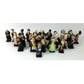 A complete set of Royal Doulton figurines of Dickens characters, twenty five in total, including Cha... 
