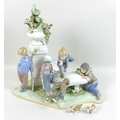 A large Lladro figural group, 'Puppy Dog Tails', 5539, sculpted by Antonio Ramos, on integral base, ... 