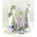 A group of modern Lladro figurines, comprising lady with puppy, 37cm, ballerina girl, and girl lying... 