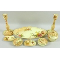 An Edwardian Royal Worcester eight piece toilet set, decorated with sprays of flowers against an ivo... 
