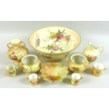 A group of Edwardian and later Royal Worcester blush ivory porcelain, comprising small twin handled ... 