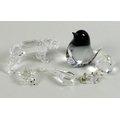 A group of five Swarovski crystal ornaments, comprising lion, hedgehog, guitar, sewing machine, and ... 