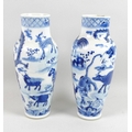 A pair of Chinese Qing Dynasty, 18th century, porcelain vases, of shouldered form, decorated in unde... 