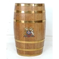 An Edwardian oak coopered barrel with brass bands, applied printed 'Coat of Arms' for S. J. Lethbrid... 