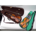 Two violins, one a 3/4 size German violin with bow, the other a Blessing 1/2 size violin, both in ha... 