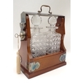 A tantalus with two cut glass decanters.