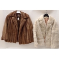 Two vintage fur coats, one possibly silver angora, the other likely mink.