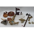 A collection of metalware and treen  including two miniature brass cannon, horse brasses, a nut crac... 