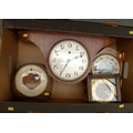 A group of four mantel clocks, comprising a Smiths, a Napoleon hat, one in an oak frame, and one wit... 