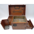 A fitted mahogany scientific instrument box with two taller bottle compartments, a light tray with p... 