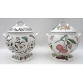 A Portmeirion double handled soup tureen in the Botanic Garden pattern on pedestal base with cover t... 