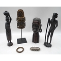 A collection of African tribal art, including a large carved head of a lady, 31cm, a pair of carved ... 