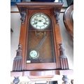 A mahogany cased Vienna wall clock, eagle surmount, with pendulum, 87cm.