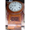 A wall clock with twin train movement, inlaid circular case with glazed door below, 74cm.