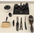 A collection of Victorian turned ebony dressing table items, several with silver mounts, including a... 
