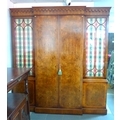 A reproduction Georgian style breakfront wardrobe, two door full length hanging, four shelves flanke... 