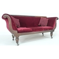 An early Victorian mahogany framed settee, with scroll ends, carved leaf decoration, burgundy fabric... 