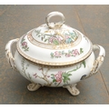 An early 19th century porcelain twin handled tureen and cover, of squat circular form, printed and o... 