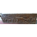 A bronze effect plaster wall plaque, cast in relief depicting a merchant train in Germany, titled 'K... 