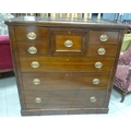 An Edwardian mahogany veneered chest of seven drawers with reeded sides, and brass lockplates and ha... 