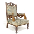 A Victorian mahogany armchair, with pierced shaped back and the arms pierced with heart motifs, pale... 