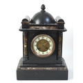 A slate mantel clock, inlaid with marble, twin train movement, 25 by 17 by 36cm high.
