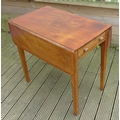 A mahogany Pembroke table, with crossbanded edge and ebony stringing, single drawer raised on square... 