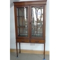 An Edwardian mahogany and chequered inlay display cabinet, two astragal glazed doors enclosing two s... 