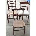 A group of three chairs, comprising an oak country ladderback with rush seat, an early Victorian mah... 