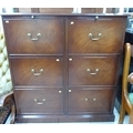A modern mahogany veneered double filing cabinet with six drawers, with two keys.