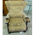 An early to mid 20th century rocking chair, vintage upholstery, a/f.