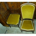 Two Victorian chairs, one a corner chair, the other a nursing chair, both upholstered in matching  m... 