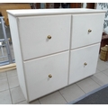 A modern pine white painted chest, with four deep drawers and brass knobs.